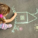 Fostering in Nottingham - foster child drawing with chalk