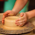 Fostering in Nottingham - Child in a pottery class